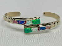 Navajo handcrafted sterling silver bracelet inlaid with lab Opal and Lapis.  LZ823