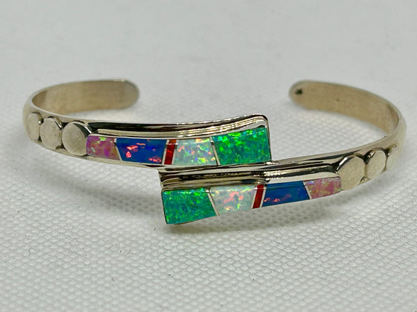Navajo handcrafted sterling silver bracelet inlaid with lab Opal and Lapis.  LZ823
