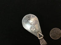 Navajo handcrafted sterling silver pendant with genuine turquoise stone.  LZ306
