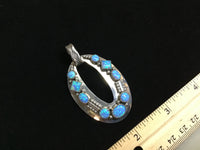 Navajo handcrafted sterling silver pendant with Lab Opal.  LZ295