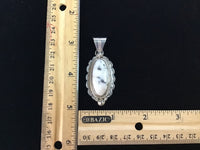 Navajo handcrafted sterling silver pendant with WhiteBuffalo Stone.  LZ297