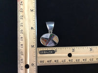 Navajo handcrafted sterling silver pendant with genuine stone inlay.  LZ304