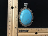 Navajo handcrafted sterling silver, genuine turquoise, 2.50” top to bottom. LZ083