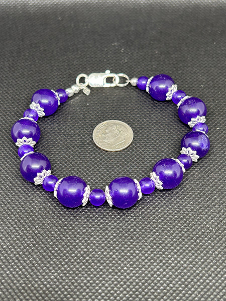 Handcrafted Purple Jade bracelet with filigree sterling silver bead enhancers. 7.5”. SR1126 FREE SHIPPING IN THE CONTINENTAL USA.