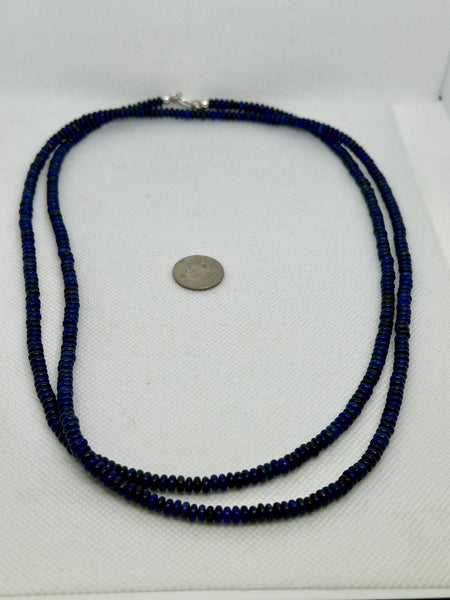 Genuine Lapis stones cut into saucer beads in a 42” necklace with sterling silver. SR 2007 FREE SHIPPING IN THE CONTINENTAL USA.