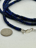 Genuine Lapis stones cut into saucer beads in a 42” necklace with sterling silver. SR 2007 FREE SHIPPING IN THE CONTINENTAL USA.