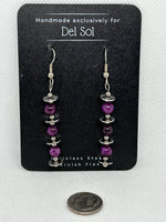 Sugulite dangle earrings in a one of a kind design.  Hypoallergenic stainless steel. EP168 FREE SHIPPING IN THE CONTINENTAL USA.
