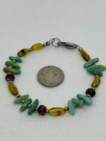 Genuine Amber and Turquoise stones in a bracelet with hypoallergenic stainless steel beads and clasp. EP159 FREE SHIPPING IN THE CONTINENTAL USA.