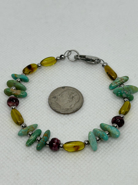 Genuine Amber and Turquoise stones in a bracelet with hypoallergenic stainless steel beads and clasp. EP159 FREE SHIPPING IN THE CONTINENTAL USA.