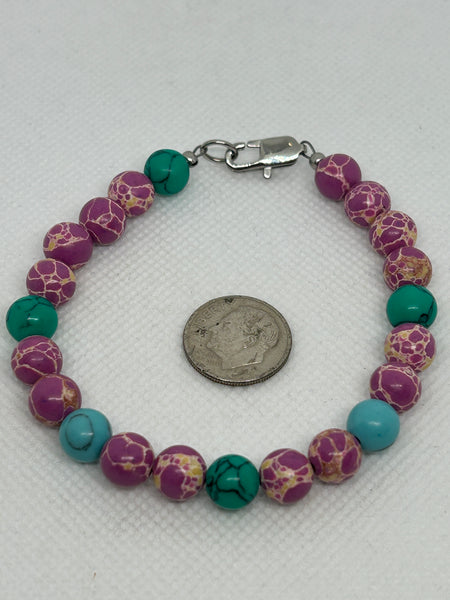 Turquoise and pink stone bracelet with a hypoallergenic stainless steel clasp. EP160 FREE SHIPPING IN THE CONTINENTAL USA.