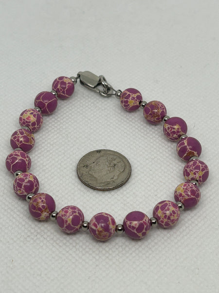 Pink stone bracelet with hypoallergenic stainless steel beads and clasp.  EP162 FREE SHIPPING IN THE CONTINENTAL USA.