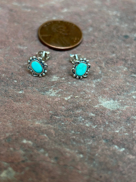 Sterling silver and genuine turquoise post earrings.  PS8