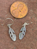 Sterling silver feather earrings. PS19
