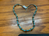 Navajo style pearls with genuine Kingman turquoise in an adjustable length from 23” to 25”. SR116