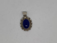 Navajo handcrafted sterling silver pendant with genuine Lapis stone.  LZ340