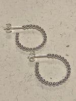 Sterling silver post earrings in hoop design. PS6