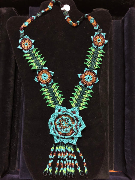 Green with blue seed bead necklace in floral motif.