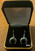 Sterling silver and genuine turquoise wire earrings. PS21
