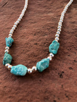 Genuine Campitos Turquoise nuggets in a matte finish, natural color with sterling silver 4mm beads.  15”.   SR122