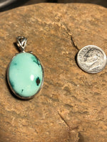 Turquoise stone pendant handcrafted in sterling silver