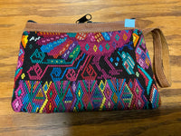Handwoven vintage fabric wristlet bag with leather. 9” x 6”.