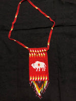 Red glass beadwork in a shoulder bag