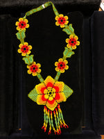 Orange and green floral seed bead necklace.