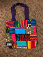 Handwoven Guatemalan cotton patches fashioned into a sturdy shoulder bag, fully lined with one zipper pocket. 15” x 17”