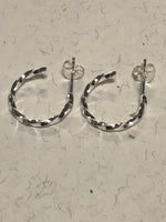 Twisted sterling silver hoop style earrings with posts. PS5