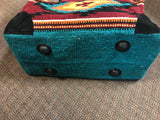 Handwoven recycled acrylic Southwest style weekender bag.  22” x 10” x 12” high.