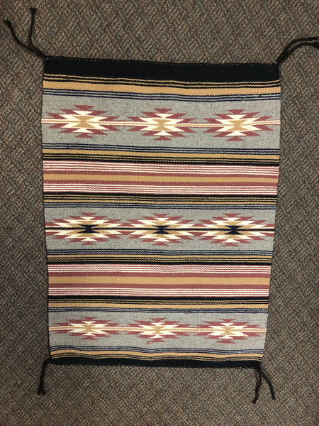 Authentic Navajo handwoven rug from the 1980’s.  Perfect condition, never used, approximately 23” x 31”.