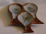 Ken Edwards Spoonrest (U6) Ken Edwards Stoneware Pottery in natural grey clay color with brown rim and blue, green, and black birds, butterflies and leaves decorated on the exterior on vases, interior on plates , trays and triviets.
