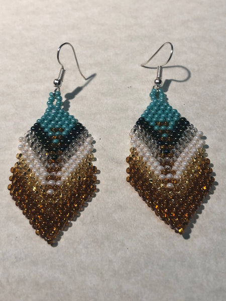 Guatemalan handcrafted glass seed beads in earrings in a feather design.