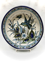 Hummingbird in blue rim bowl
