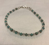 Natural African 4 mm stone beads with sterling silver.  7.5” bracelet SR111 FREE SHIPPING IN THE CONTINENTAL USA.