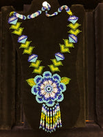 Blue a green seed bad necklace with floral motif