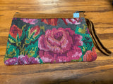 Handwoven vintage fabric wristlet bag with leather. 9” x 6”.