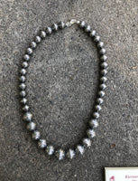 Navajo Pearl style sterling silver bead necklace in 4 sizes of beads, decorated with flowers in a 20” length.  By A.S.   AS613