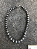 Navajo Pearl style sterling silver bead necklace in 4 sizes of beads, decorated with flowers in a 20” length.  By A.S.   AS613