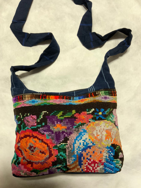 Guatemalan handcrafted needlepoint purses with zipper and e terror zippered pocket.  Approximately 12” x 8”, fully lined.