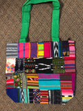 Handwoven Guatemalan cotton patches fashioned into a sturdy shoulder bag, fully lined with one zipper pocket. 15” x 17”