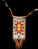 A shoulder bag handmade entirely of glass beads in a Native American inspired design.