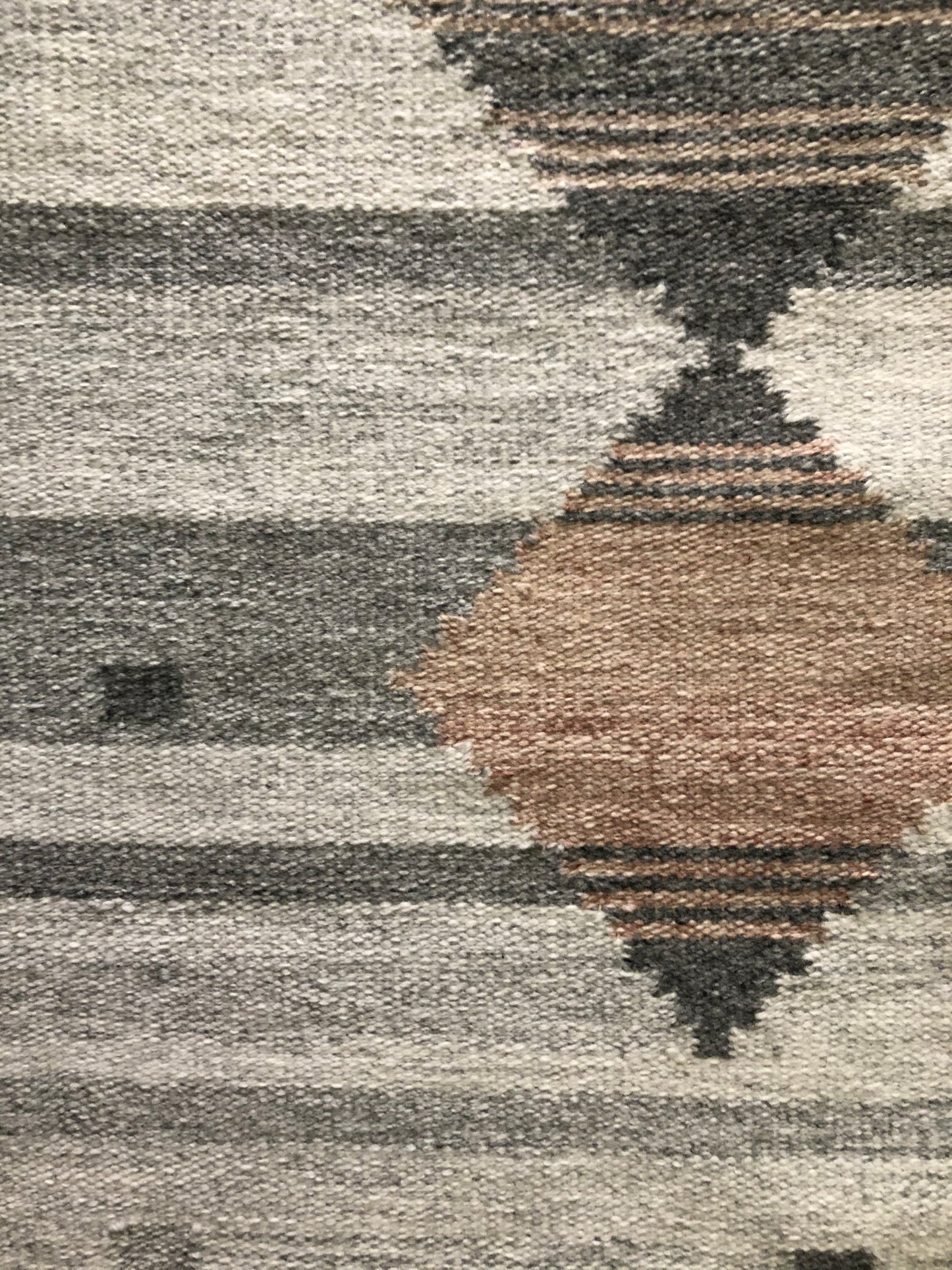 Handwoven rug made from recycled fibers plastic water bottles aka PET