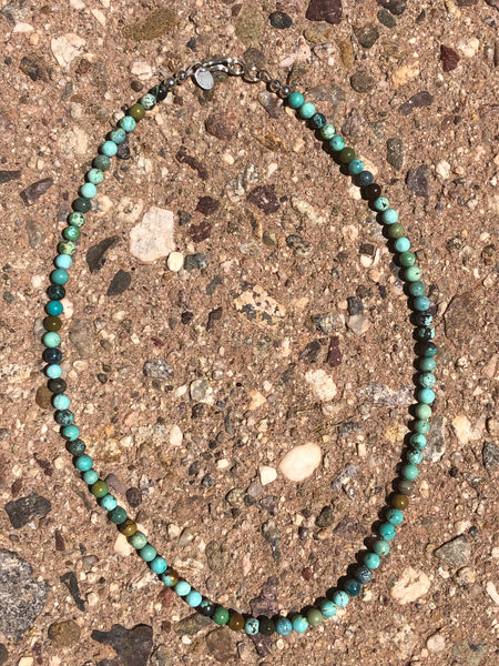Genuine Turquoise in multi color with sterling silver in 18” length, by A.S.  EB2