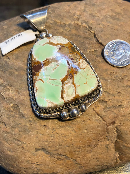 Turquoise stone pendant handcrafted in sterling silver.   X-2