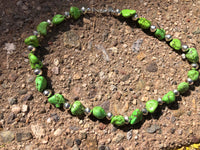Green turquoise necklace in 17.5” length.  The stones are dyed to resemble natural  Gaspeite.  The stones are alternated  with  Navajo hand soldered sterling silver  beads .   A.S.   GT-1 FREE SHIPPING IN THE CONTINENTAL USA.