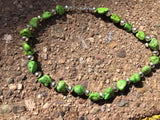 Green turquoise necklace in 17.5” length.  The stones are dyed to resemble natural  Gaspeite.  The stones are alternated  with  Navajo hand soldered sterling silver  beads .   A.S.   GT-1 FREE SHIPPING IN THE CONTINENTAL USA.