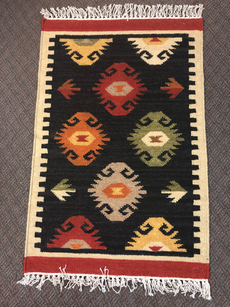 Handwoven wool rug in 2’ x3’ Shree 118 with cotton fringe.