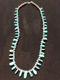 Genuine and natural color Campitos turquoise teardrop necklace with etched Aztec design sterling silver beads and lobster claw clasp. 25”.  A.S.
