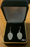 Flat skull earrings in sterling silver. PS11